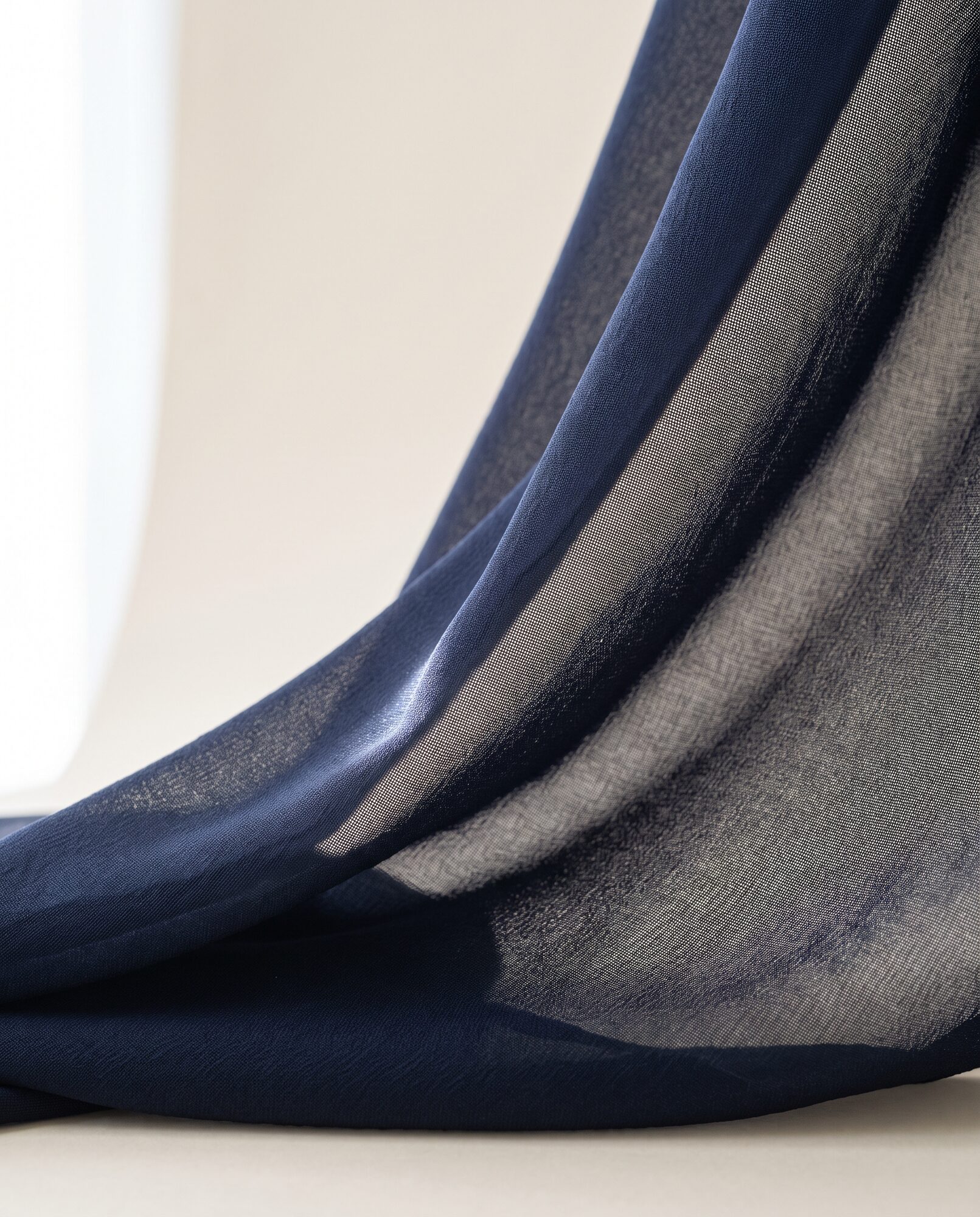 Midnight navy chiffon in close-up, showing the sheer drape