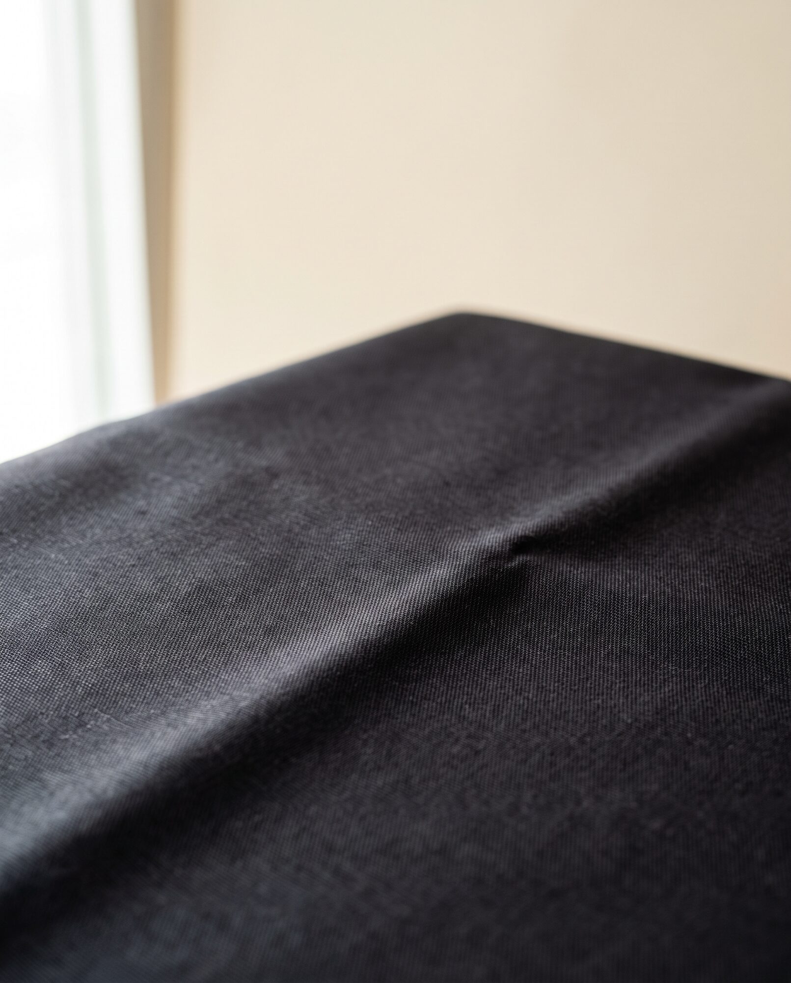 Black cambric in close-up, showing the tight cotton weave
