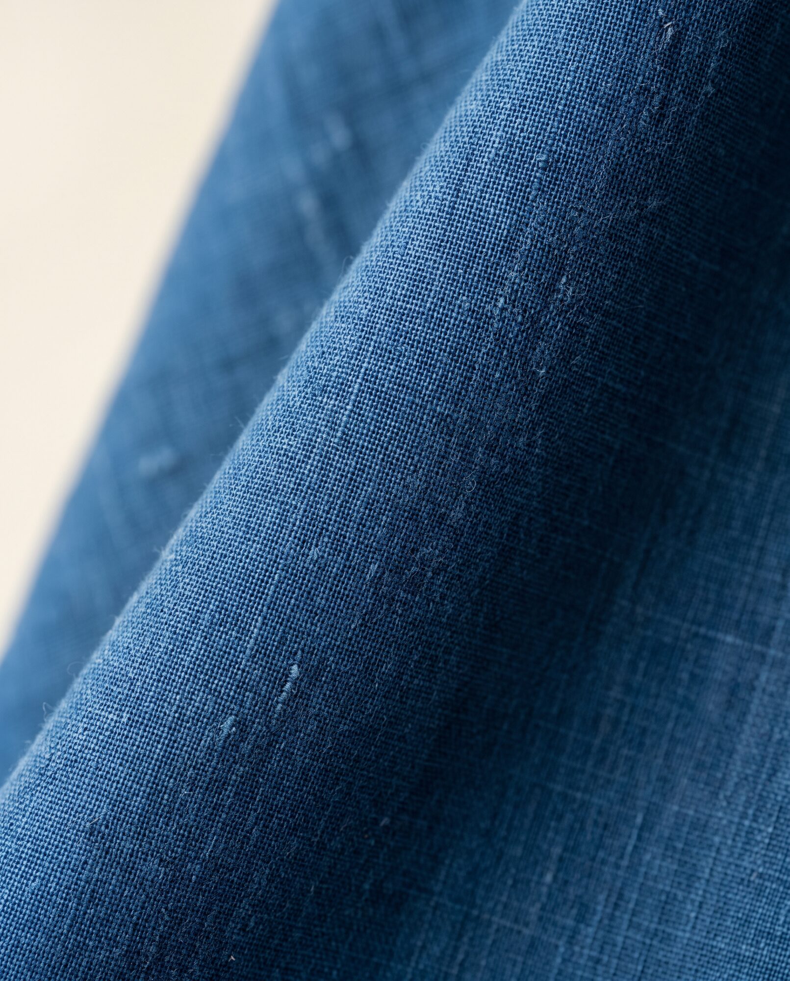 Indigo lawn in close-up, showing the weave and the drape of the cloth