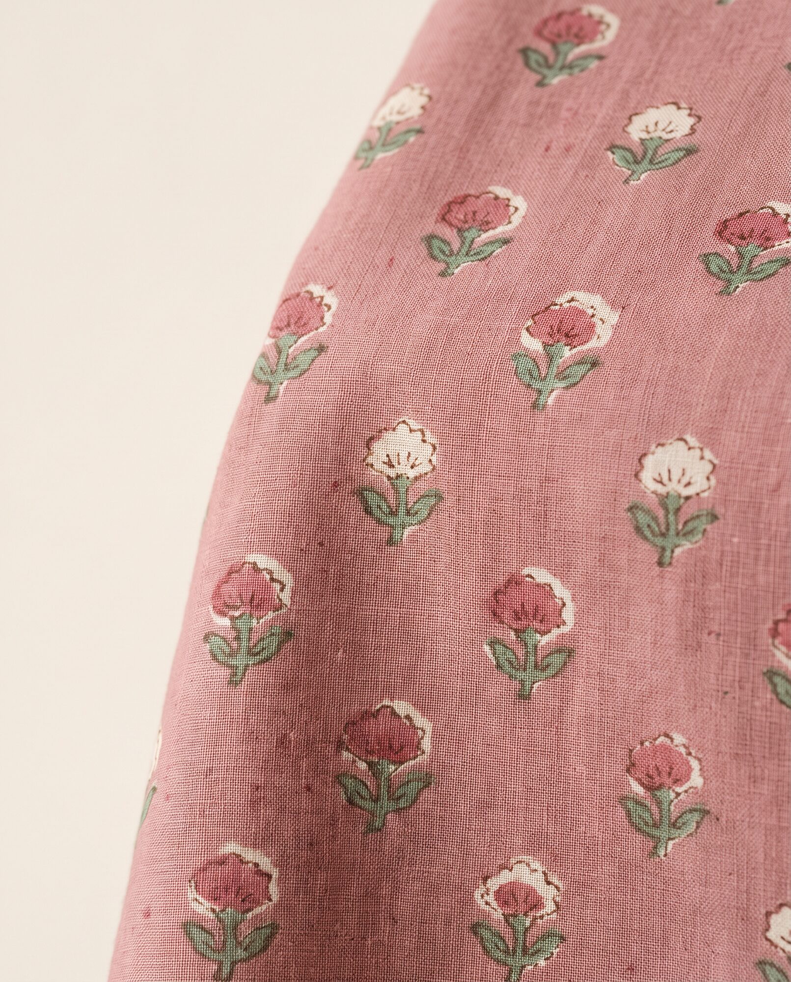 Close-up of the small-scale block print, with the soft motif edges a carved block leaves