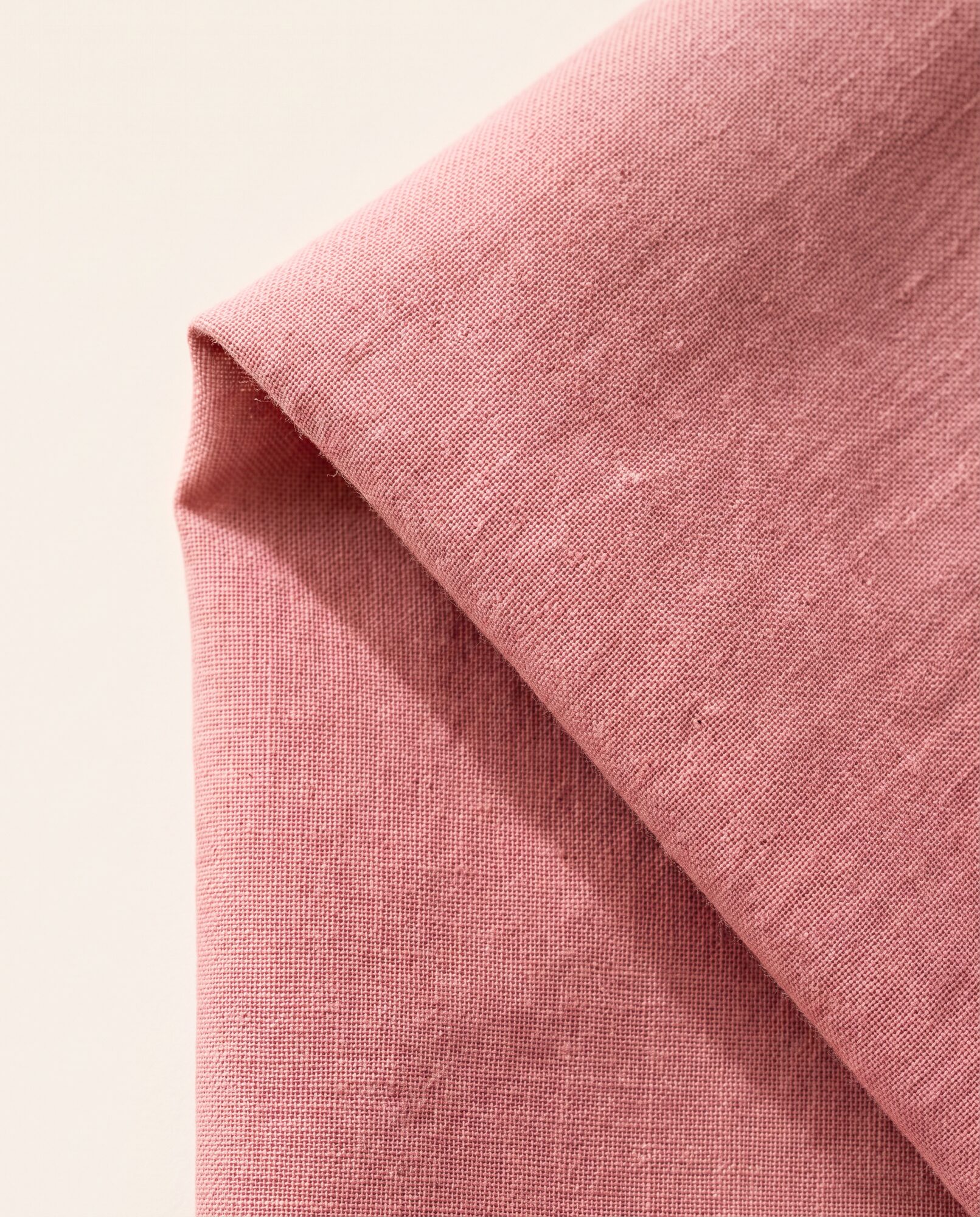 Dusty rose lawn in close-up, showing the weave and the drape of the cloth