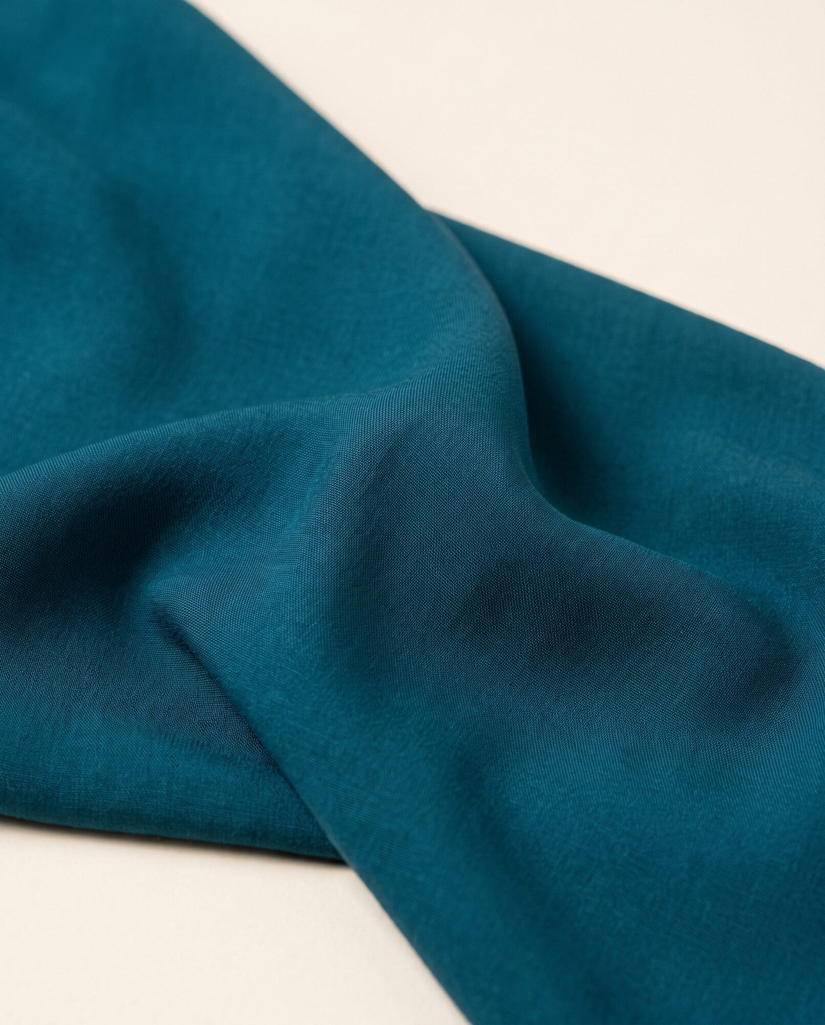 Teal viscose in close-up, showing how the cloth drapes